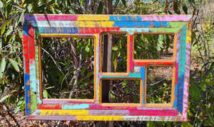 Photo frame for 5 pictures, 4 small and 1 large in bright painted colors made with recycled timber. A great Australian eco friendly gift idea