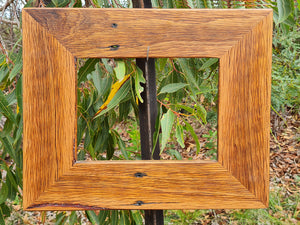 9cm wide timber picture frame size A4 in Australian brown gum has beautiful grain and some rustic nail holes features. Available in many sizes at WombatFrames