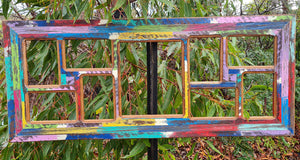Unique picture frames in brightly painted Australian recycled timber with 8 smaller opening and one enlargement opeing in the middle