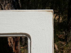 White hand painted timber picture frame moulding in shabby chic finish for WombatFrames 