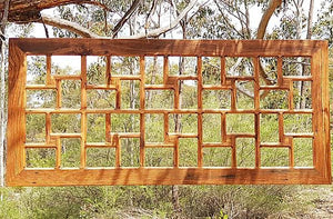 Huge photo collage timber picture frame for 40 photos or artworks, a photo album on the wall. Here in recycled Australian hardwood brown gum