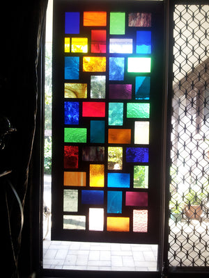 Stained Glass Screen  behind one of our large multi photo collage frames